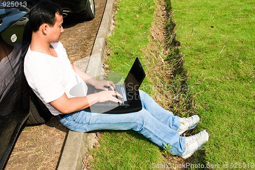 Image of man using laptop