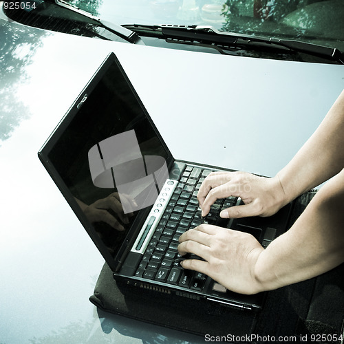 Image of man using laptop