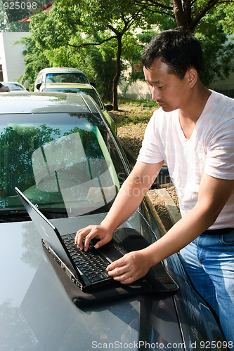 Image of man using laptop