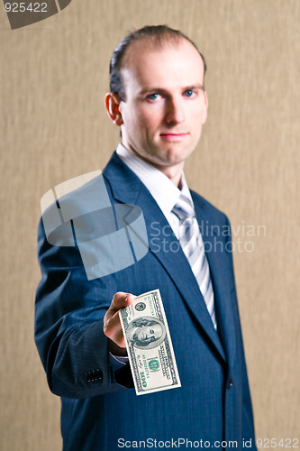 Image of  A man in a suit with money