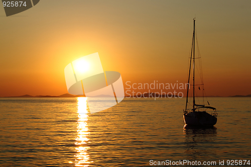 Image of Gold romantic sunset with yacht