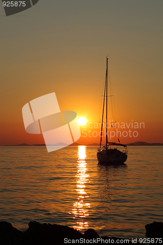 Image of Gold romantic sunset with yacht