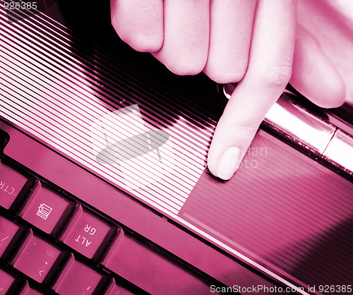Image of Working at laptop .