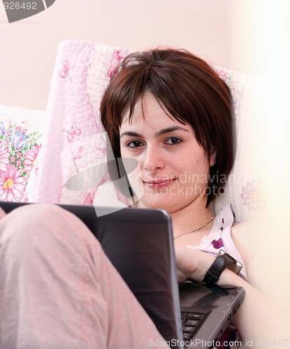 Image of Young woman with laptop 