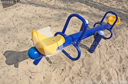 Image of An empty seesaw in a playground