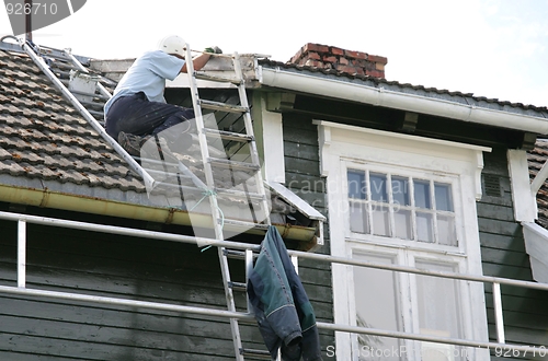 Image of Painter on a roof