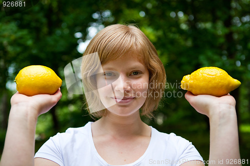 Image of Girl holding lemons