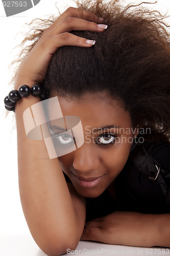 Image of beautiful black woman, holding her hair with his hands