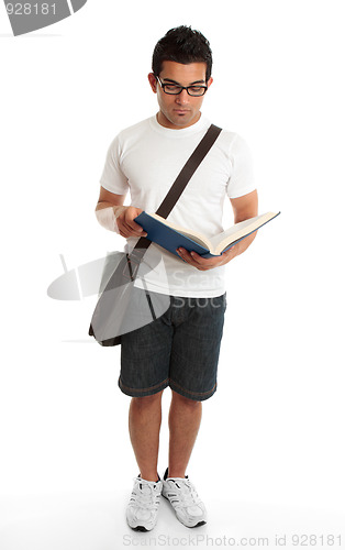 Image of Standing student reading book studying