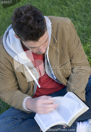 Image of Young man reading