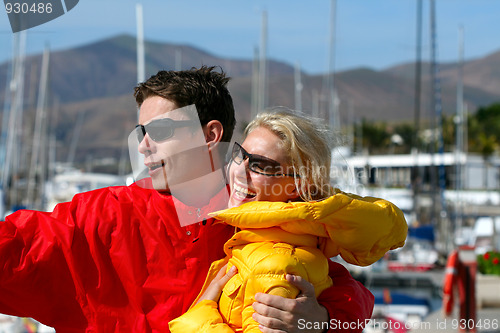 Image of young man and woman in the port 