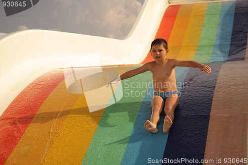 Image of Boy on colorful water slide