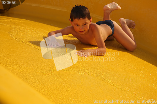 Image of Boy on water slide