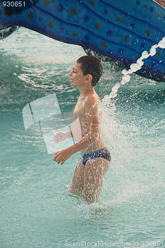 Image of Little boy under water jet