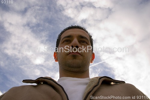 Image of Man Looking up with the Clouds on the Background