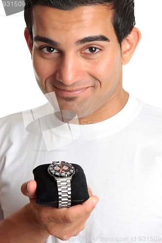 Image of Man holding a chronograph wrist watch