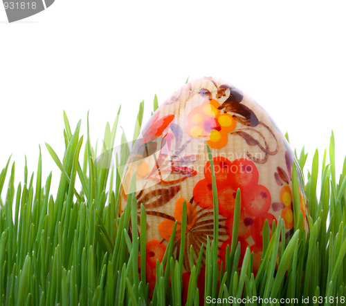 Image of Easter egg in the grass isolated on white 