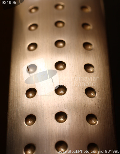 Image of spherical metal surface background with holes