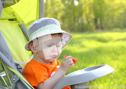 Image of baby eating outdoor