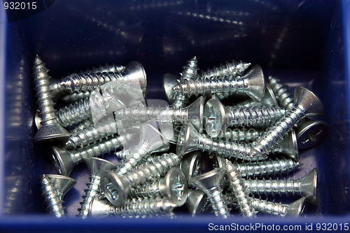 Image of little screws in box