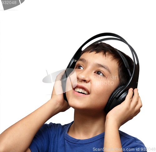 Image of boy listening music in headphones