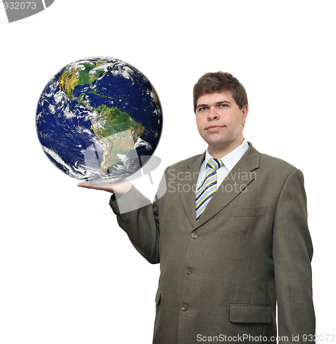 Image of businessman holding earth planet on palm