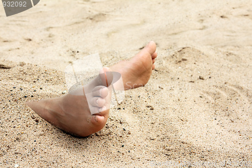 Image of bare foot in sand