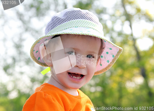 Image of smiling baby in hat outdoor