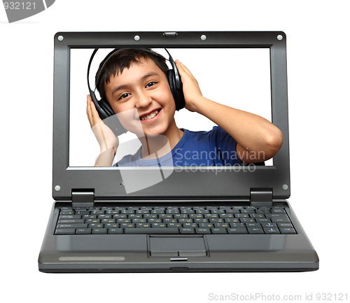 Image of laptop with child listening music
