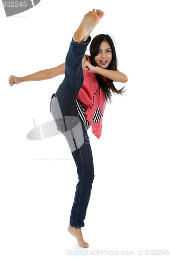 Image of woman kicking