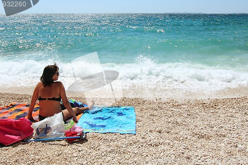 Image of Middle age woman in the beach