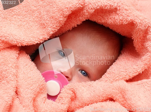 Image of newborn baby with soother