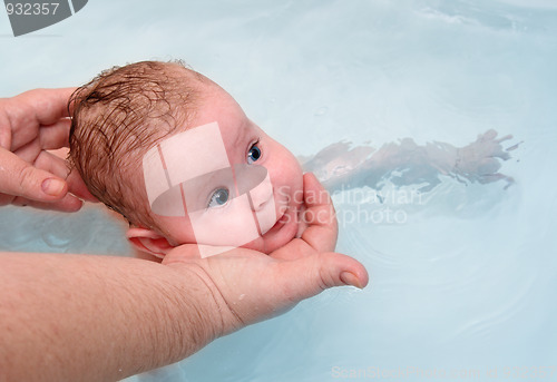 Image of small baby learn to swimming