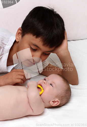 Image of asian boy and caucasian baby