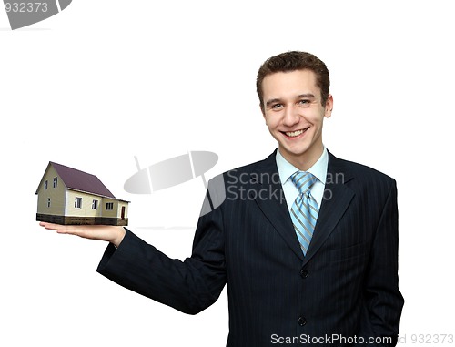 Image of businessman with house in hand