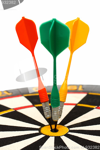 Image of dartboard with darts in aim