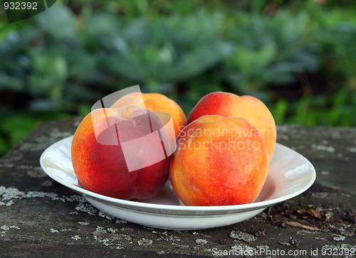 Image of peaches on old wooden table