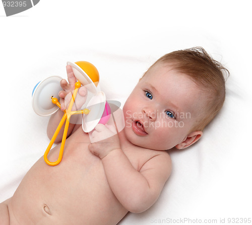 Image of baby girl with rattle