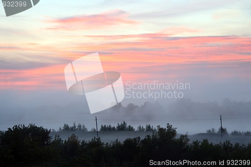 Image of mist landscape with sunrise over lake