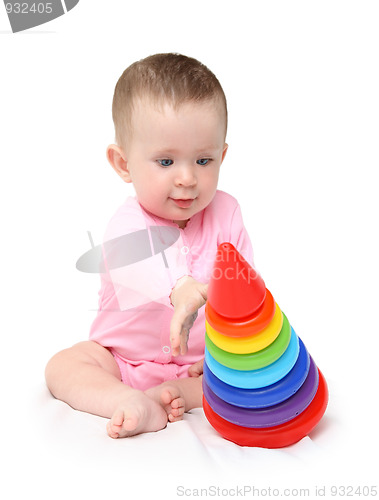 Image of baby girl playing with pyramid
