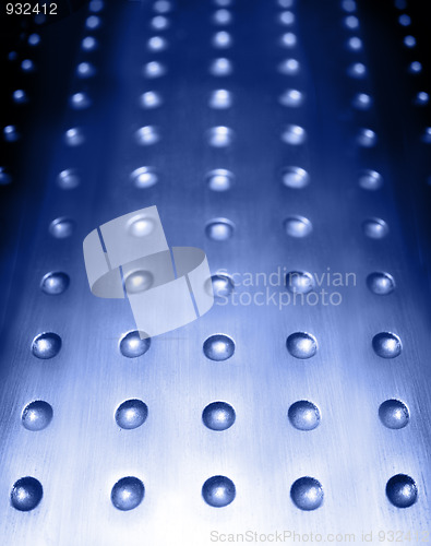 Image of blue metal surface background with holes