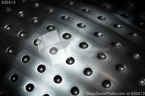 Image of spherical metal surface background with holes