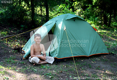 Image of smiling boy near camping tent