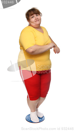 Image of overweight woman on gymnastic disc