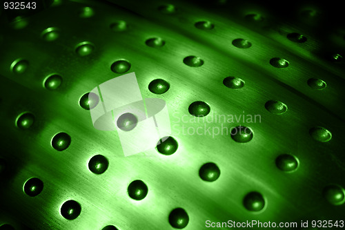 Image of spherical metal green surface background with holes