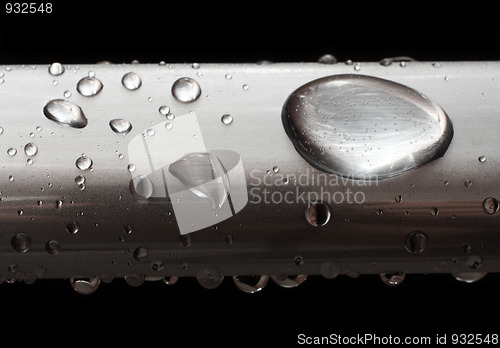 Image of water drops on misted metal tube