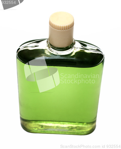 Image of old bottle with green cologne