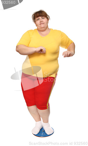 Image of overweight woman on gymnastic disc