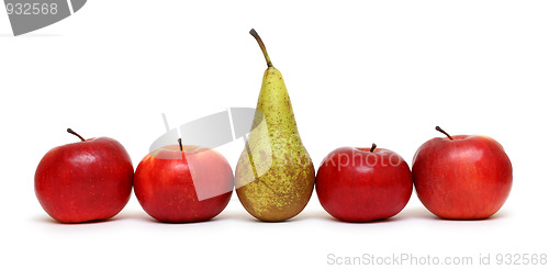 Image of different - pear between green apples