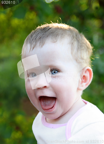 Image of happy laughing baby outdoor